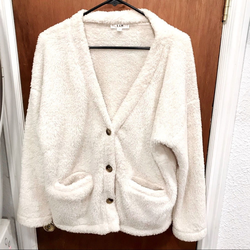 E&M White fuzzy cardigan sweater.